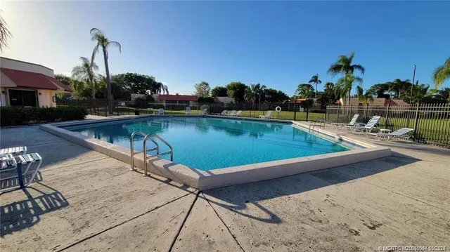 a view of a backyard with sitting area