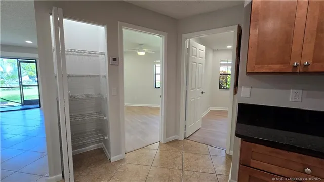 a bathroom with a double vanity sink and glass door