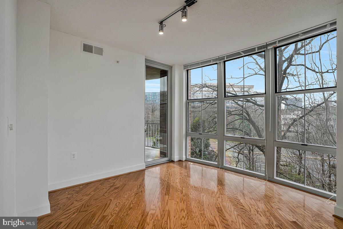 11800 Sunset Hills Road, Unit 514 Reston, VA 20190 - Photo 32 of 57 wooden floor in an empty room with a window