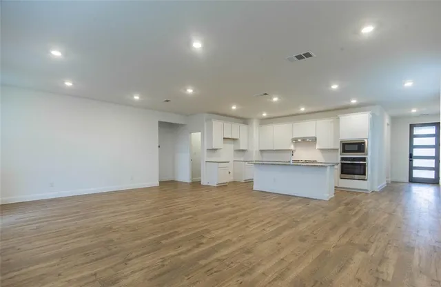 a view of kitchen with wooden floor