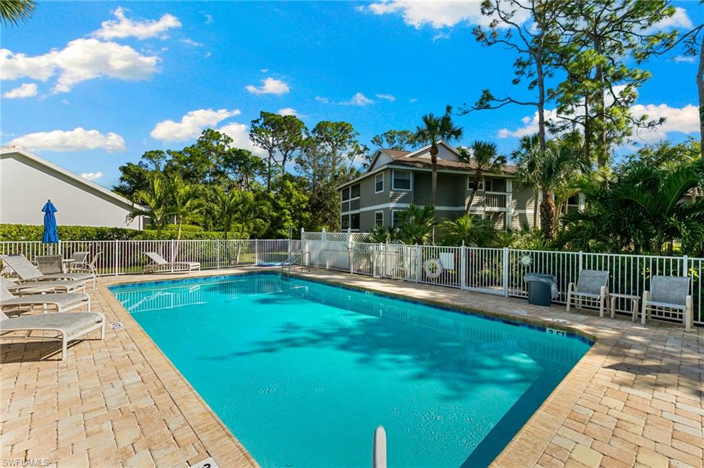 614 Wiggins Bay Drive Naples, FL 34110 - Photo 22 of 35 Community pool featuring a patio