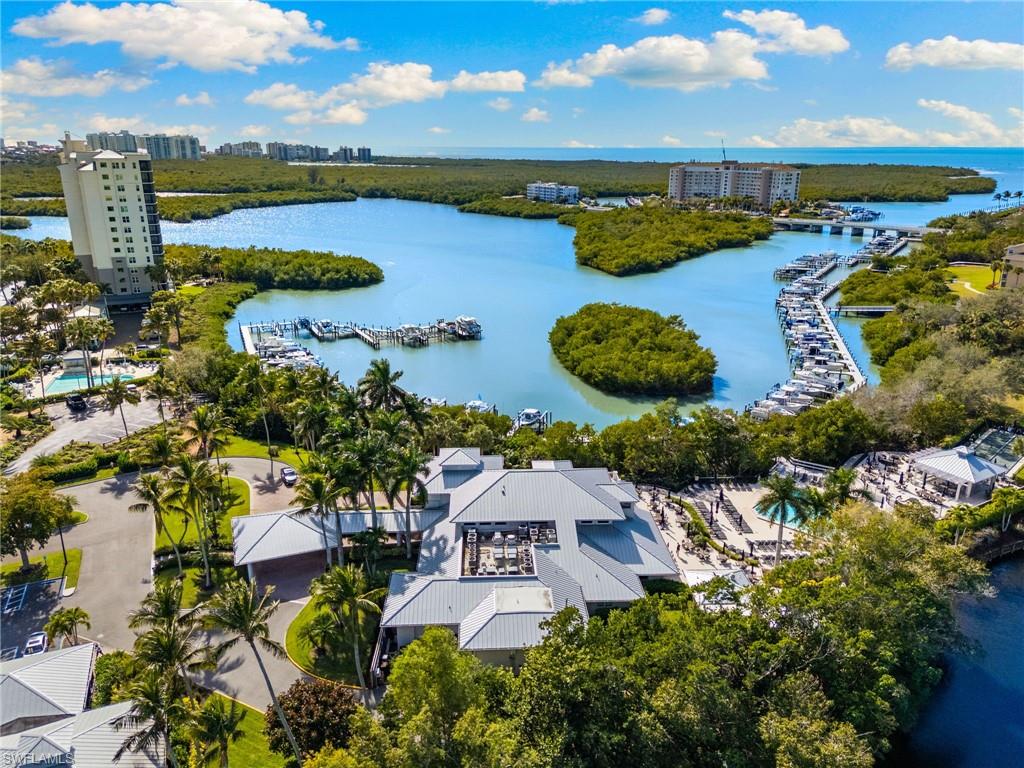 614 Wiggins Bay Drive Naples, FL 34110 - Photo 31 of 35 View of urban area with a large body of water and a marina