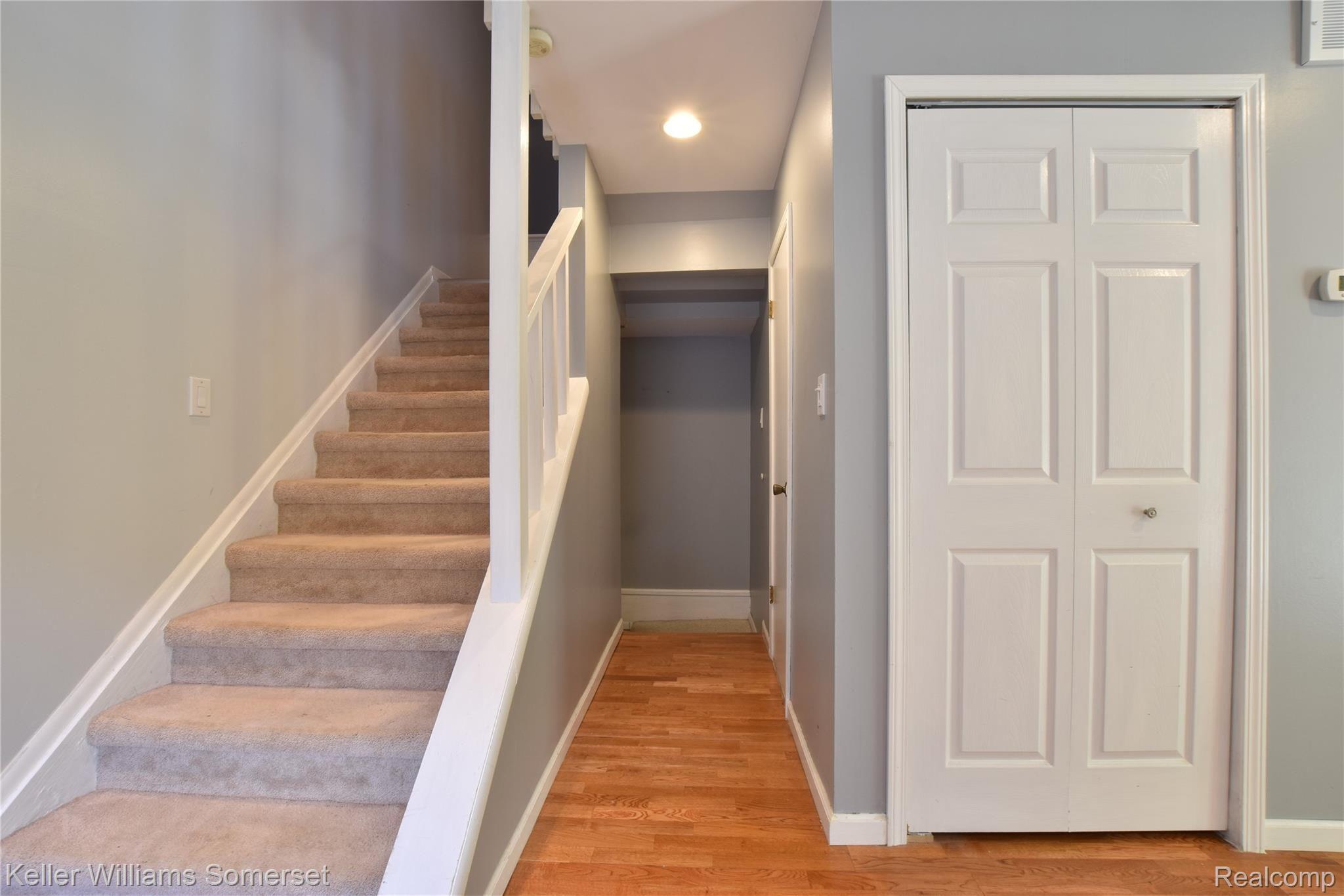 5075 Crooks Road, Unit 12 Royal Oak, MI 48073 - Photo 5 of 22 Hallway to the basement