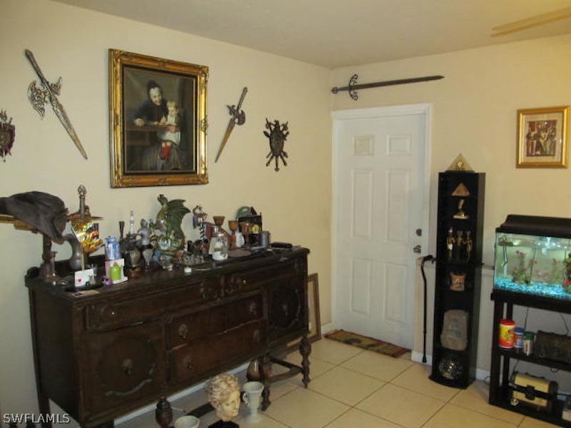 308 East Penn Road Lehigh Acres, FL 33936 - Photo 6 of 15 a room with furniture and wooden floor