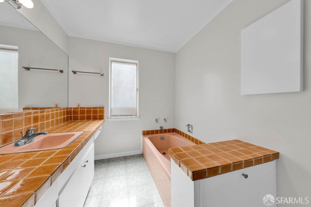 1401 Walnut Street, Unit 1B Berkeley, CA 94709 - Photo 30 of 53 a bathroom with a tub sink and mirror