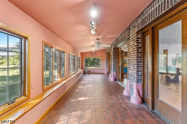 a view of a room with large windows