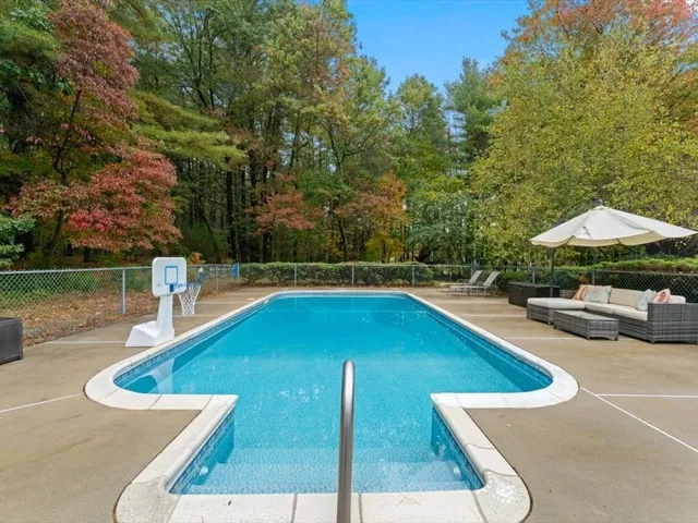a view of a swimming pool with a patio