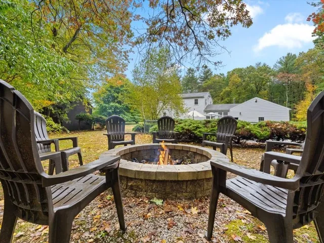 a view of swimming pool with outdoor seating and plants