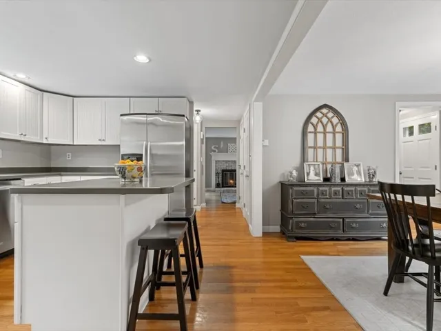 a view of kitchen with furniture and wooden floor