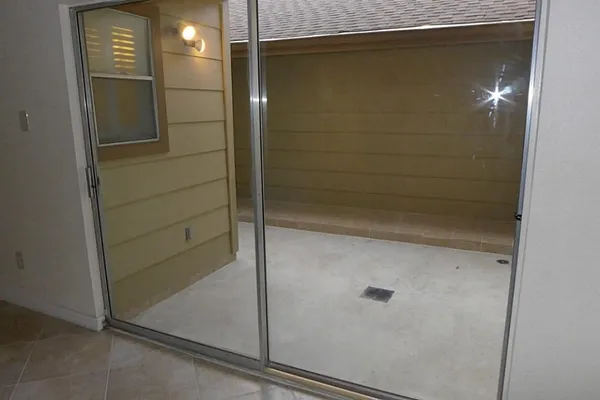 a wooden bench sitting in front of a building
