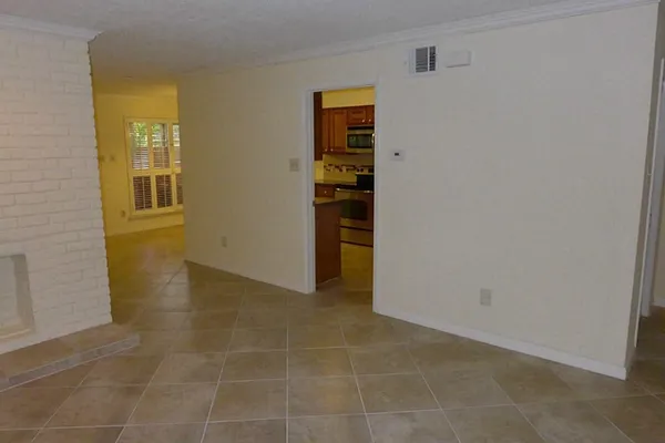 a view of an empty room with a window