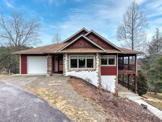 99 Old Possum Way Murphy, NC 28906 - Photo 1 of 54 a front view of a house with garden
