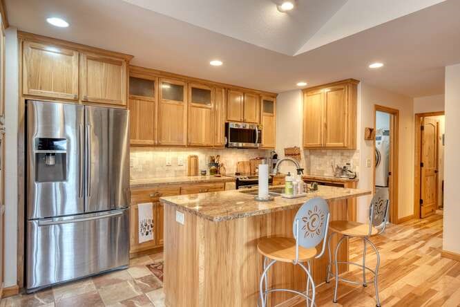 99 Old Possum Way Murphy, NC 28906 - Photo 11 of 54 a kitchen with stainless steel appliances granite countertop a refrigerator a stove a sink and a microwave