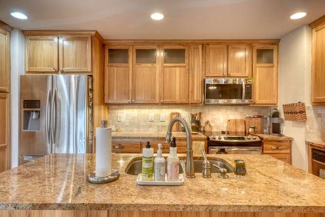99 Old Possum Way Murphy, NC 28906 - Photo 12 of 54 a kitchen with stainless steel appliances granite countertop a refrigerator and a sink