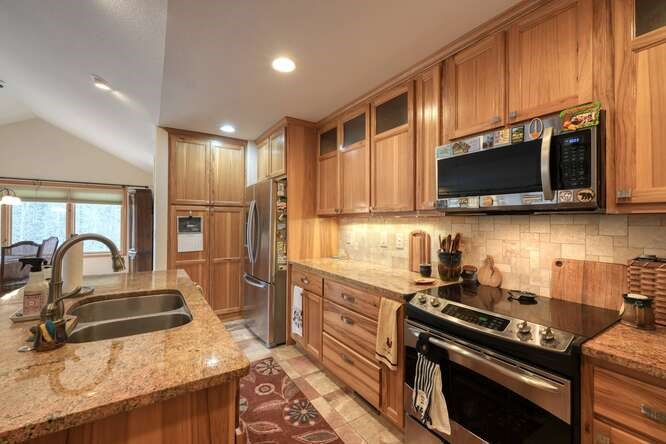 99 Old Possum Way Murphy, NC 28906 - Photo 14 of 54 a kitchen with stainless steel appliances granite countertop a stove a sink and a microwave