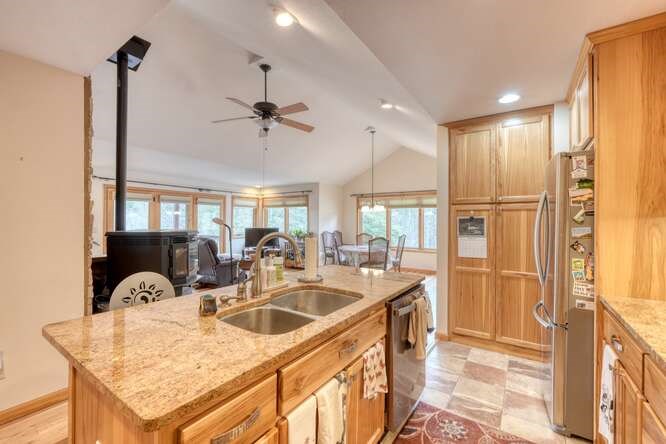 99 Old Possum Way Murphy, NC 28906 - Photo 15 of 54 a kitchen with stainless steel appliances granite countertop a sink a stove and a refrigerator