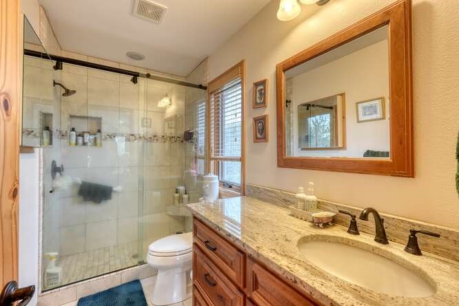 99 Old Possum Way Murphy, NC 28906 - Photo 18 of 54 a bathroom with a granite countertop sink toilet and shower