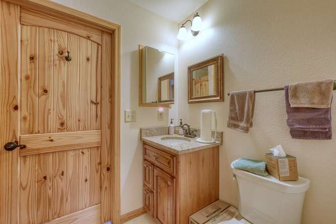 99 Old Possum Way Murphy, NC 28906 - Photo 20 of 54 a bathroom with a sink a toilet and mirror