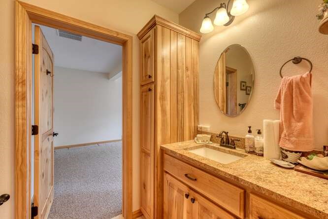 99 Old Possum Way Murphy, NC 28906 - Photo 30 of 54 a bathroom with a double vanity sink and a mirror