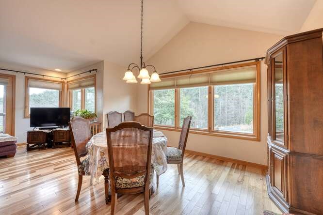 99 Old Possum Way Murphy, NC 28906 - Photo 10 of 54 a view of a dining room with furniture window and wooden floor