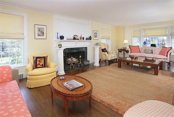 90 Baxter Road Brookline, MA 02445 - Photo 3 of 10 a living room with furniture a fireplace and a window