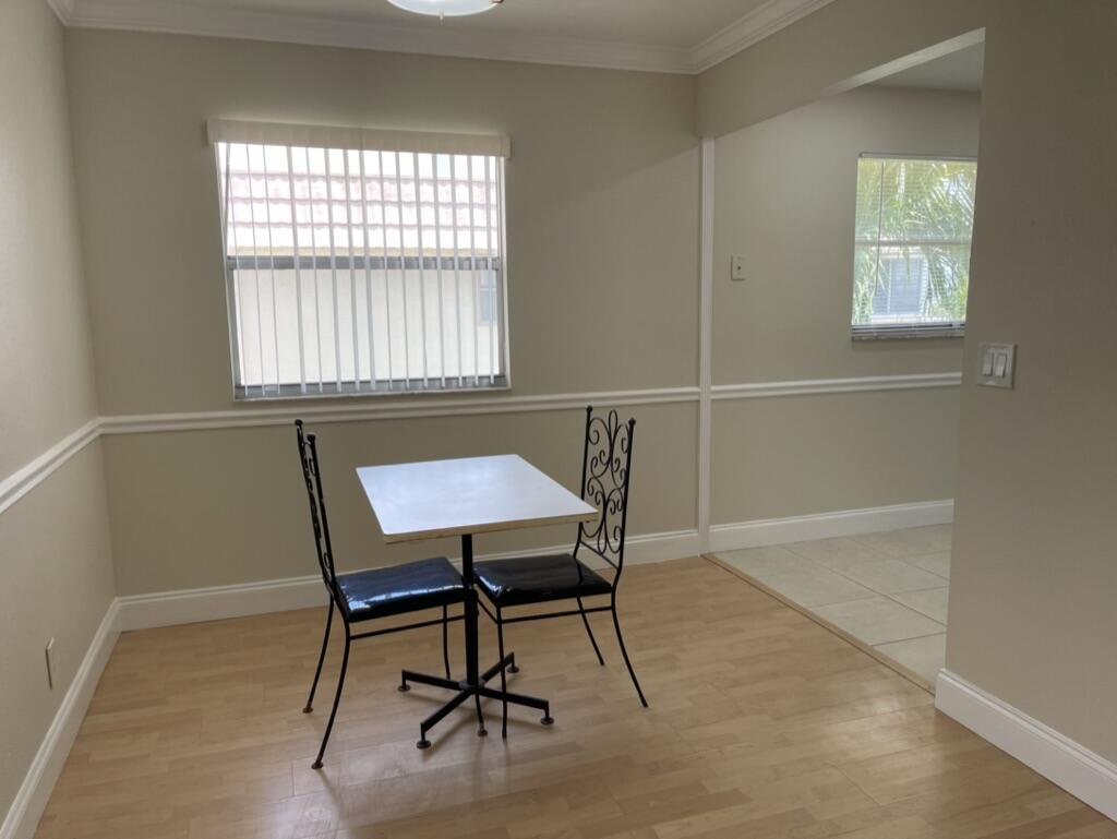 472 Saxony Way Delray Beach, FL 33446 - Photo 1 of 33 a view of a workspace with furniture and a window