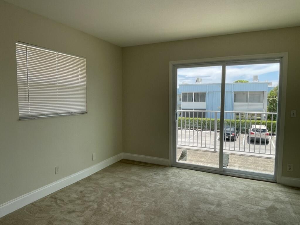 472 Saxony Way Delray Beach, FL 33446 - Photo 23 of 33 a view of an empty room with a window