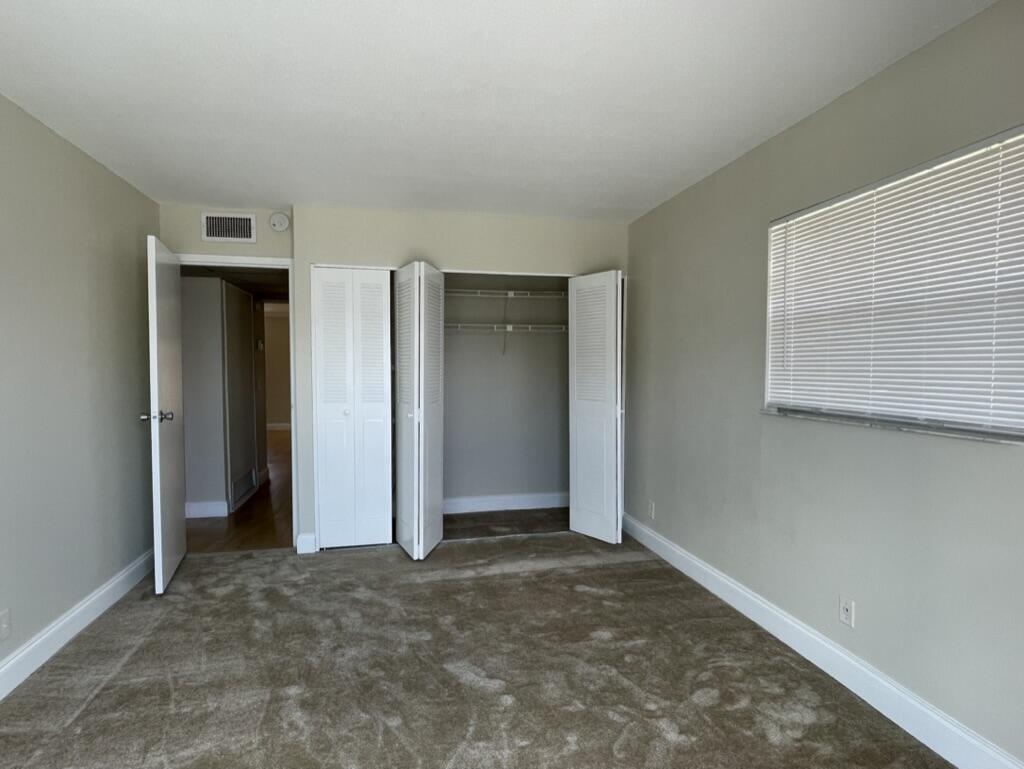472 Saxony Way Delray Beach, FL 33446 - Photo 24 of 33 an empty room that has a grey walls