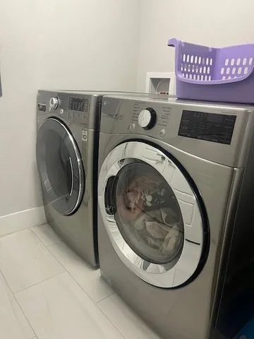a utility room with dryer and washer