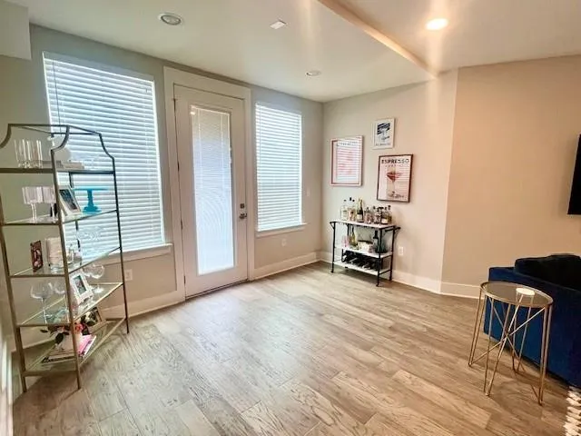 a view of a livingroom with furniture and a workspace