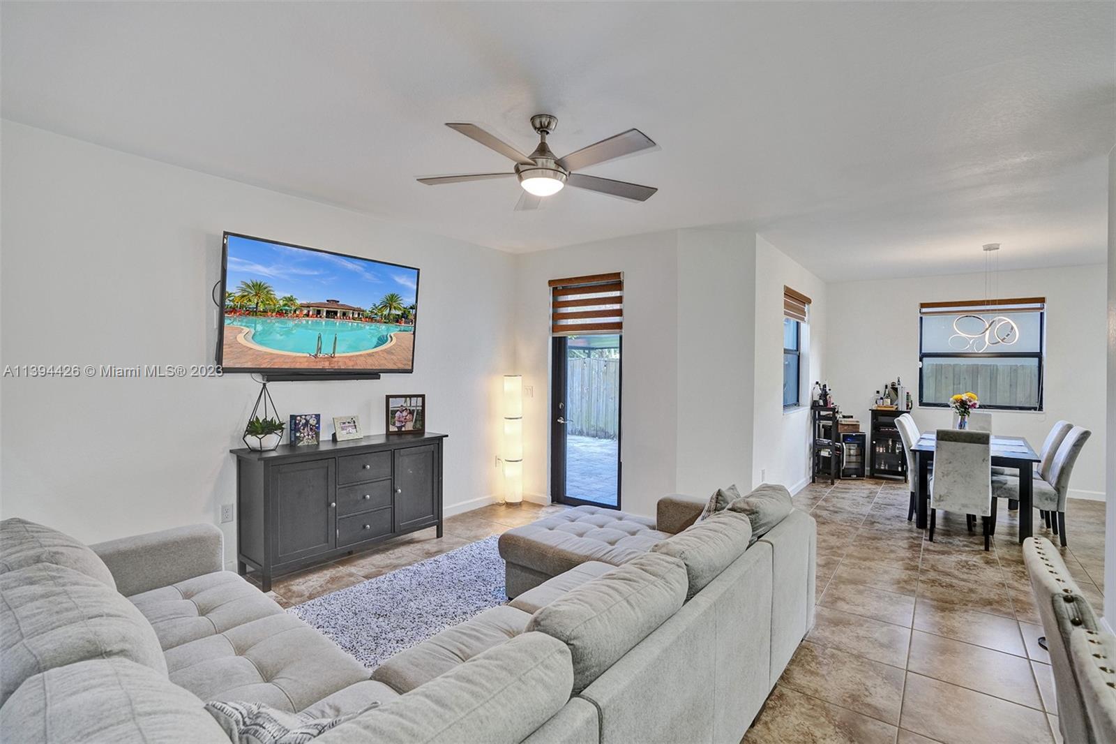 732 Southeast 33 Terrace Homestead, FL 33033 - Photo 19 of 65 a living room with furniture and a flat screen tv