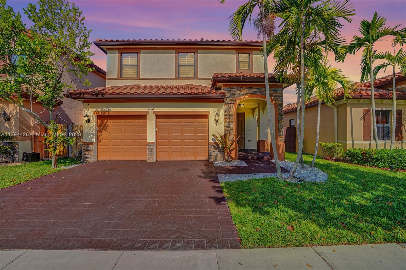 732 Southeast 33 Terrace Homestead, FL 33033 - Photo 2 of 65 a view of a house with a yard and palm trees