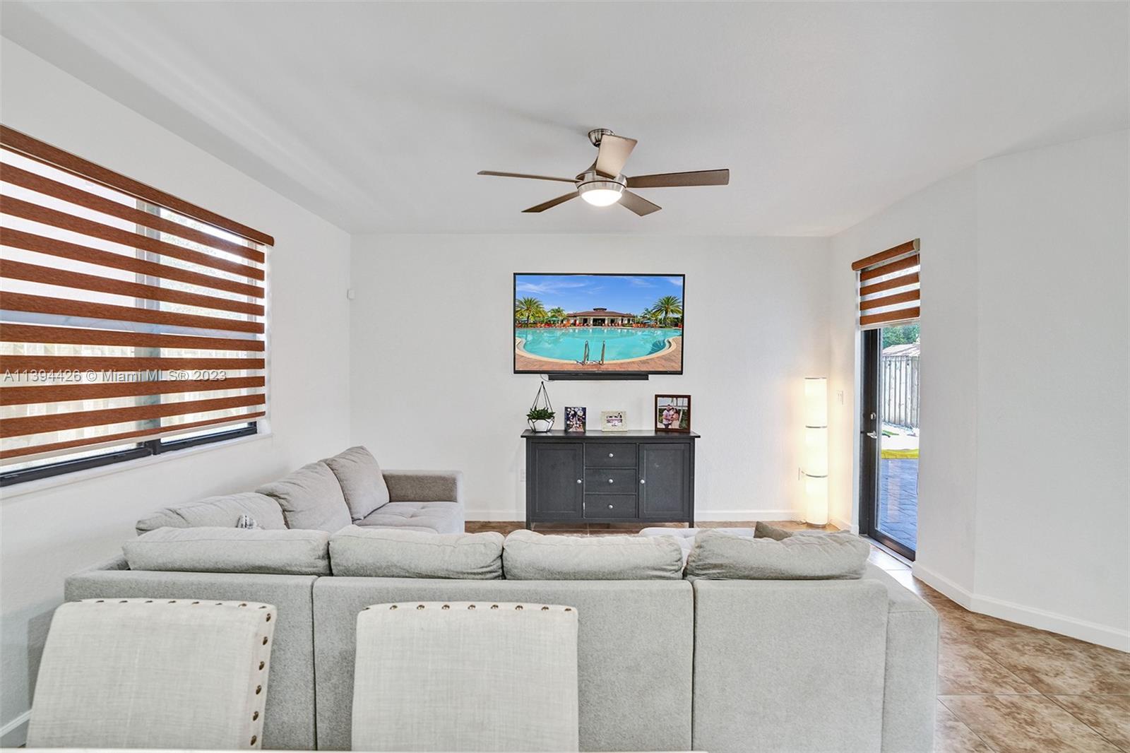732 Southeast 33 Terrace Homestead, FL 33033 - Photo 25 of 65 a living room with furniture and a window