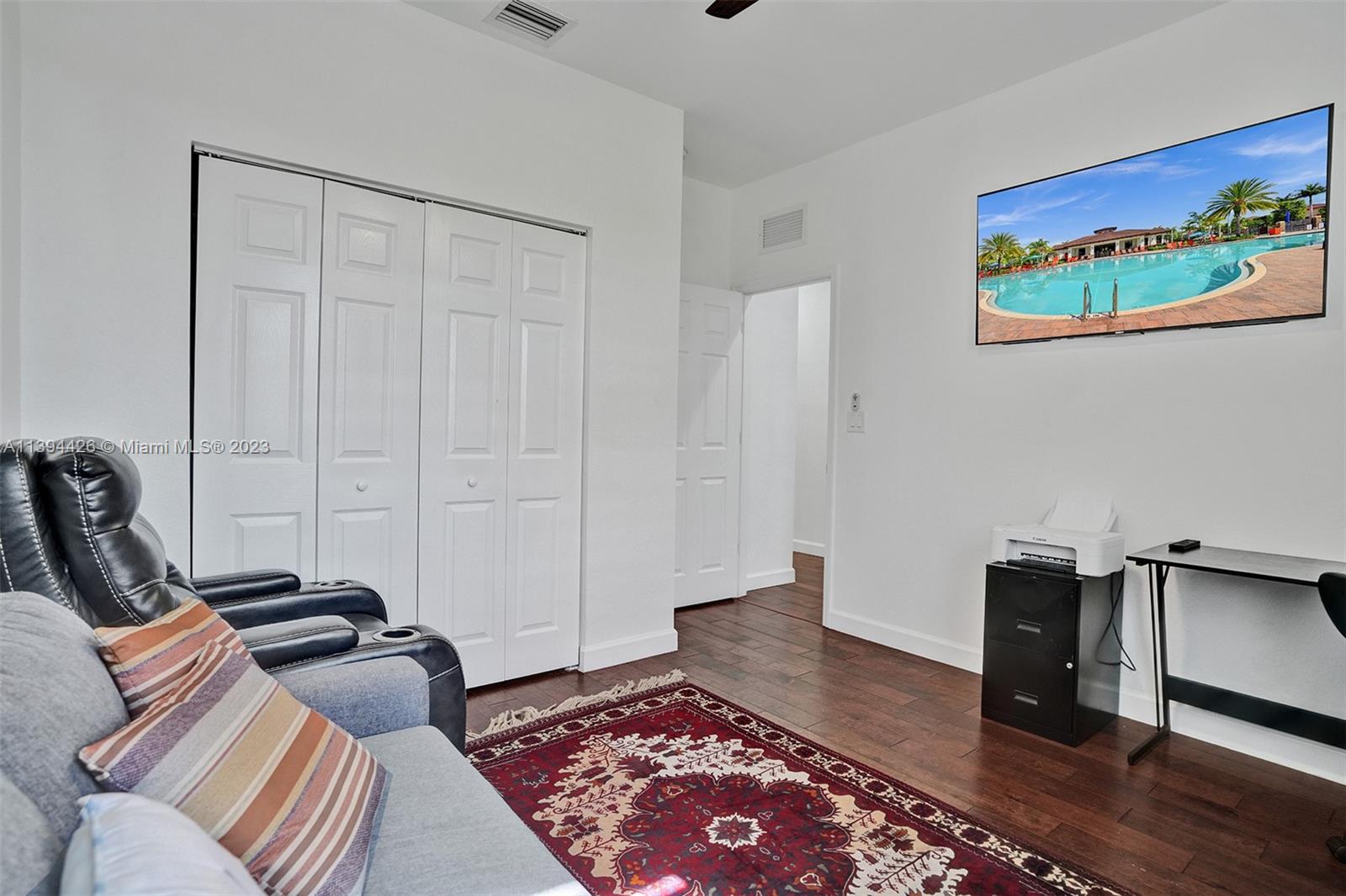 732 Southeast 33 Terrace Homestead, FL 33033 - Photo 28 of 65 a bedroom with furniture and a rug