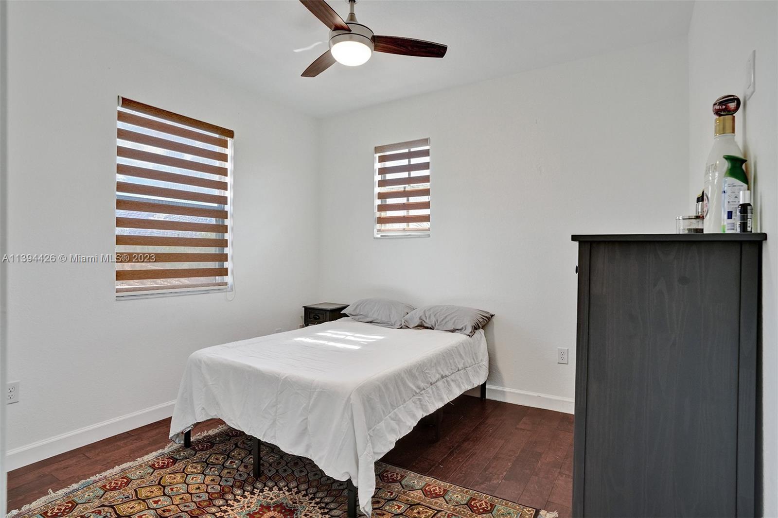 732 Southeast 33 Terrace Homestead, FL 33033 - Photo 32 of 65 a bedroom with a bed and a window