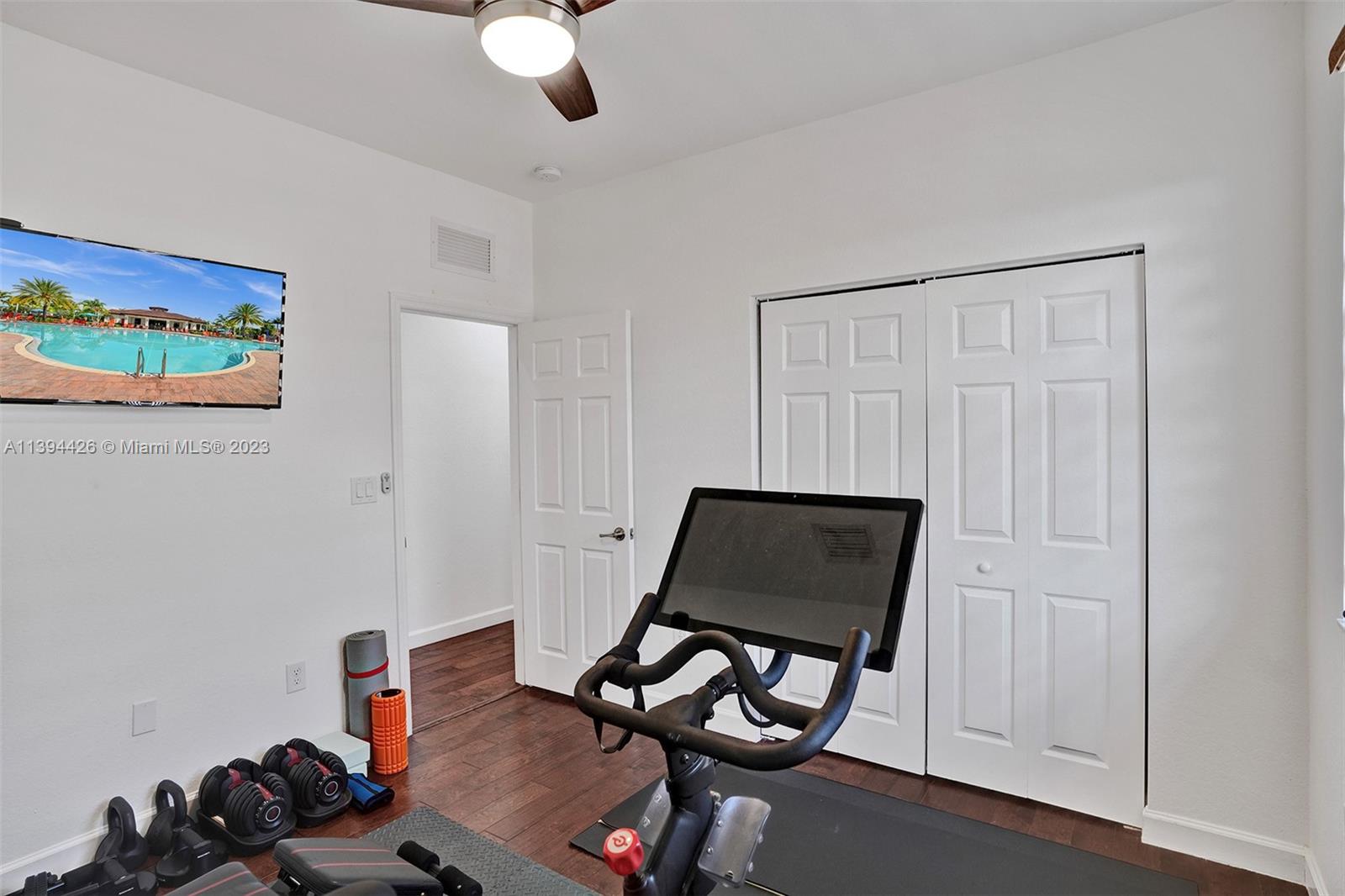 732 Southeast 33 Terrace Homestead, FL 33033 - Photo 40 of 65 a living room with furniture and a wooden floor