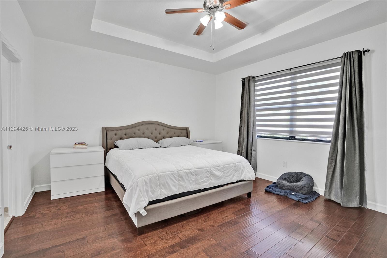 732 Southeast 33 Terrace Homestead, FL 33033 - Photo 46 of 65 a bedroom with a bed and a window