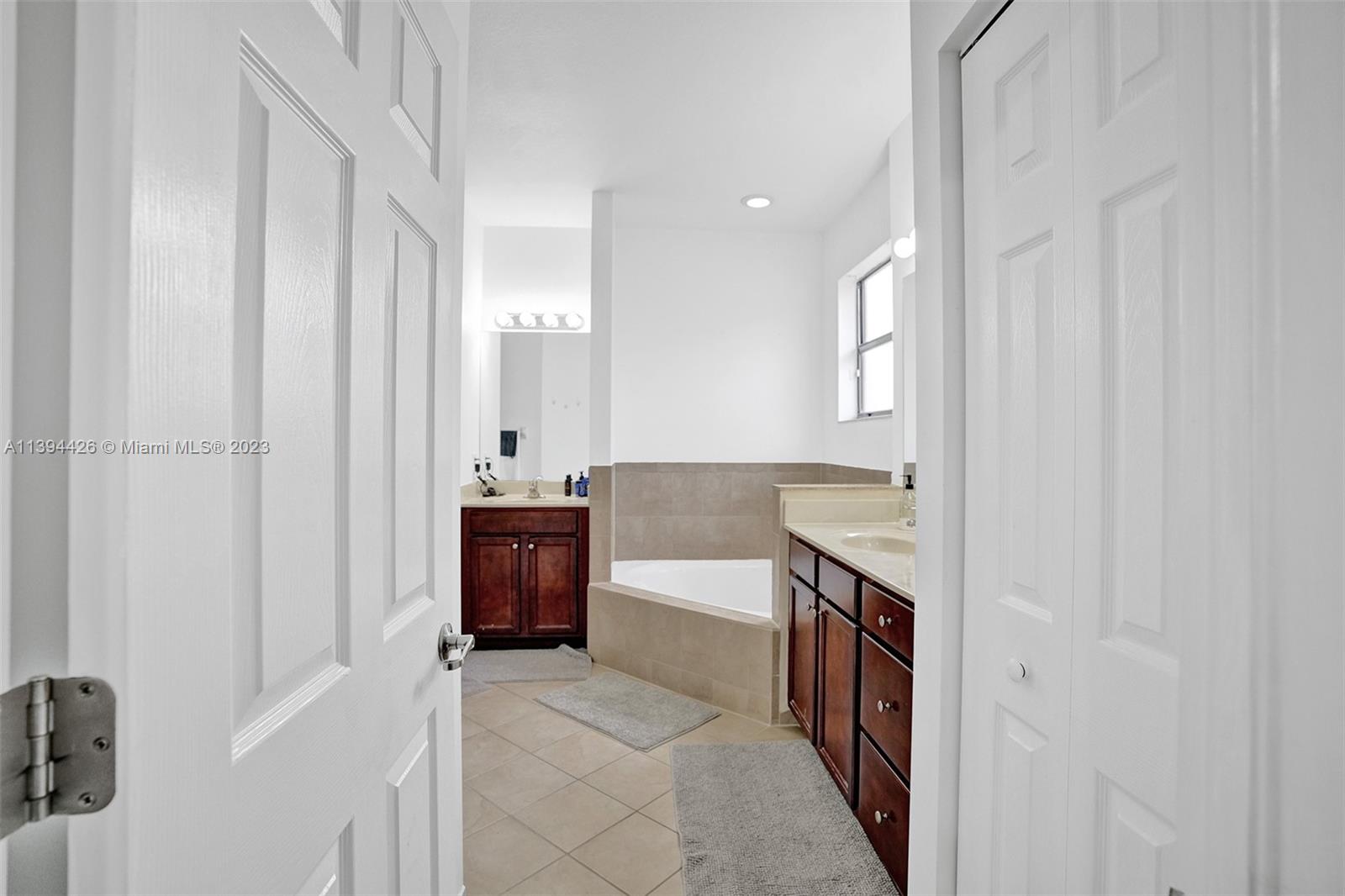 732 Southeast 33 Terrace Homestead, FL 33033 - Photo 50 of 65 a large white kitchen with a sink and dishwasher a refrigerator with white cabinets