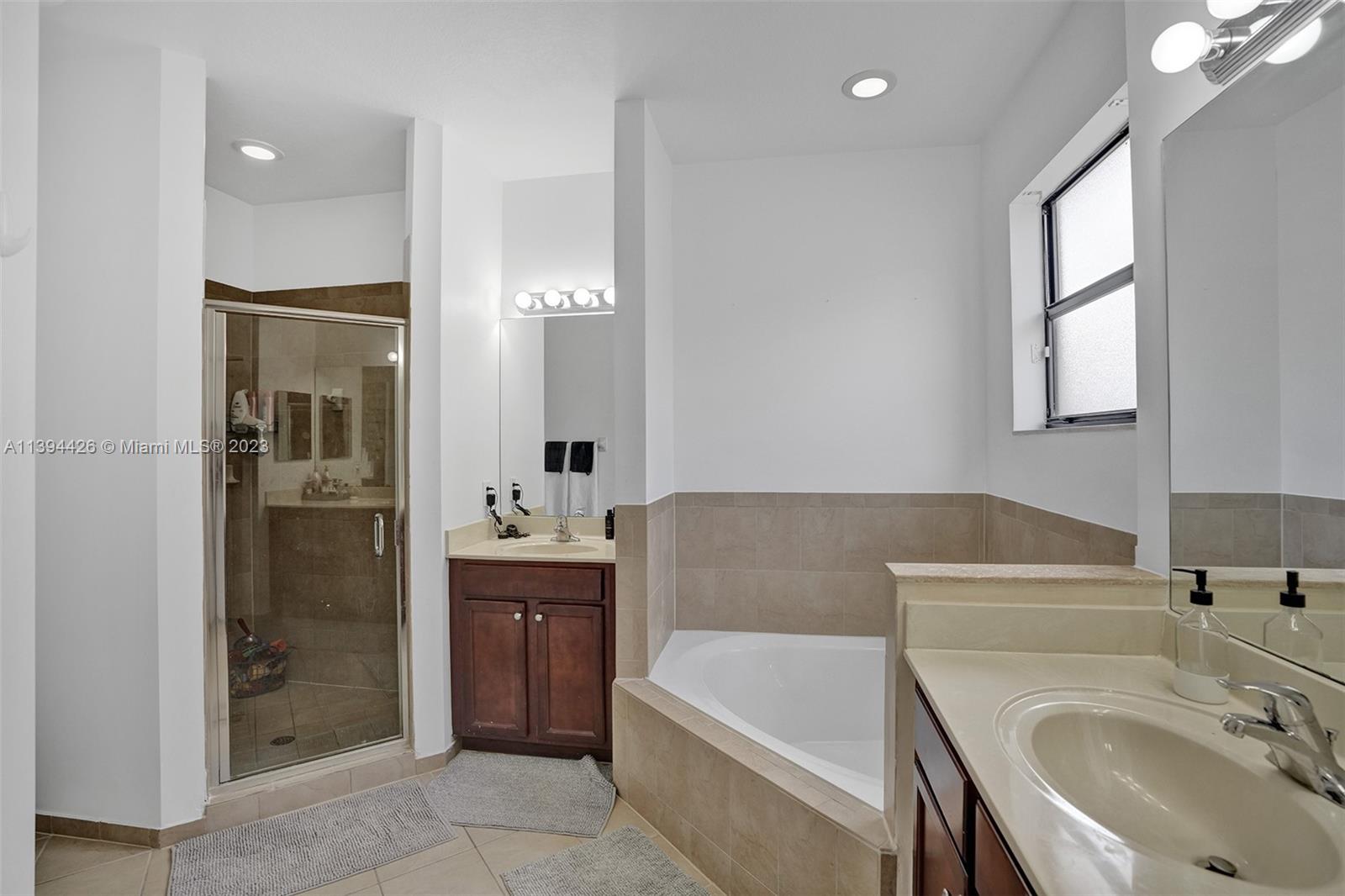 732 Southeast 33 Terrace Homestead, FL 33033 - Photo 52 of 65 a bathroom with a tub sink and mirror