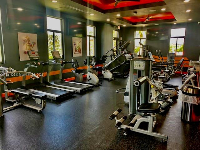 732 Southeast 33 Terrace Homestead, FL 33033 - Photo 62 of 65 a room with gym equipment and large mirror