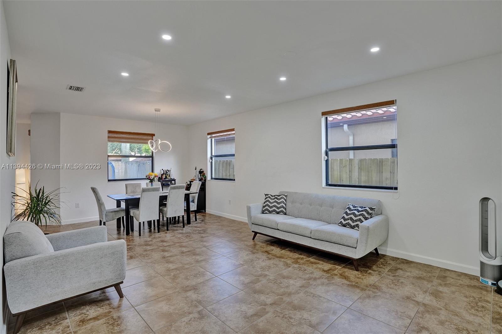 732 Southeast 33 Terrace Homestead, FL 33033 - Photo 7 of 65 a living room with furniture and white walls