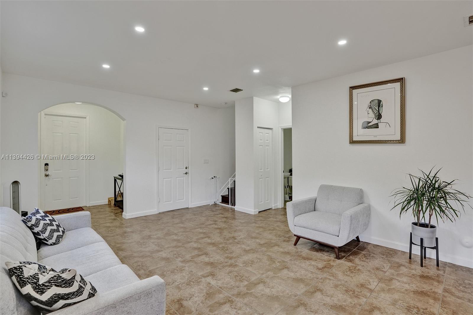 732 Southeast 33 Terrace Homestead, FL 33033 - Photo 10 of 65 a living room with furniture and a potted plant