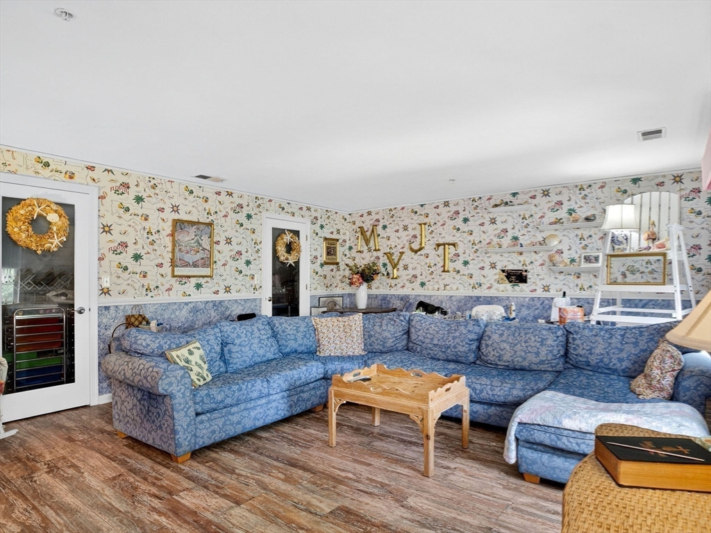 127 Clear Pond Drive, Unit 127 Walpole, MA 02081 - Photo 21 of 38 a living room with furniture and a large window