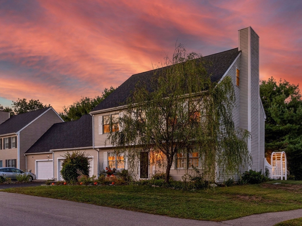 127 Clear Pond Drive, Unit 127 Walpole, MA 02081 - Photo 29 of 38 front view of house with a yard