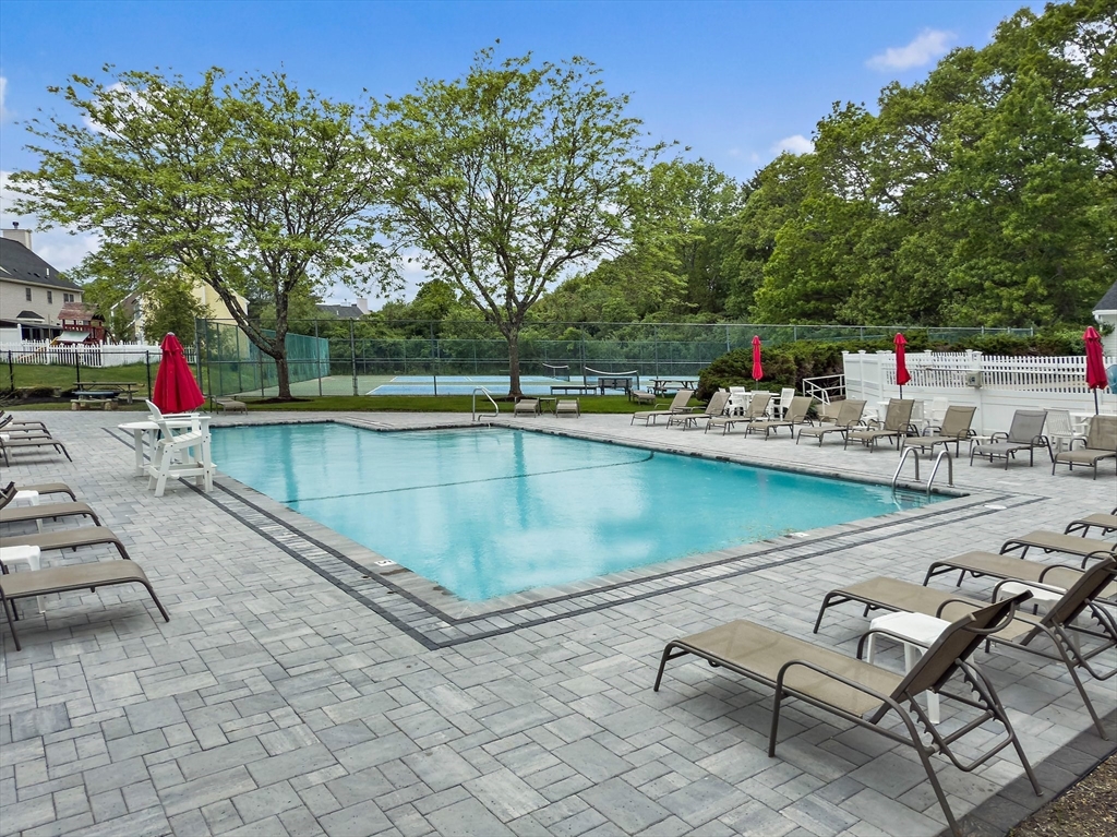 127 Clear Pond Drive, Unit 127 Walpole, MA 02081 - Photo 36 of 38 a view of swimming pool with lounge chair