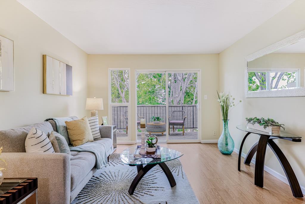 38455 Bronson Street, Unit 322 Fremont, CA 94536 - Photo 1 of 35 a living room with furniture and large window