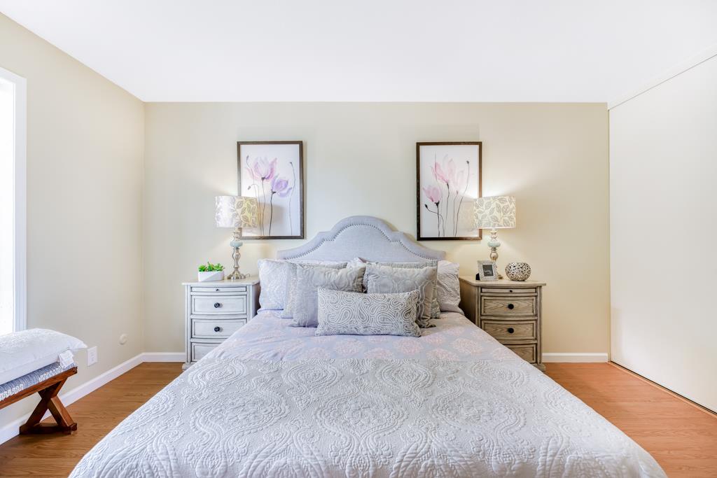 38455 Bronson Street, Unit 322 Fremont, CA 94536 - Photo 16 of 35 a bedroom with a bed and wooden floor