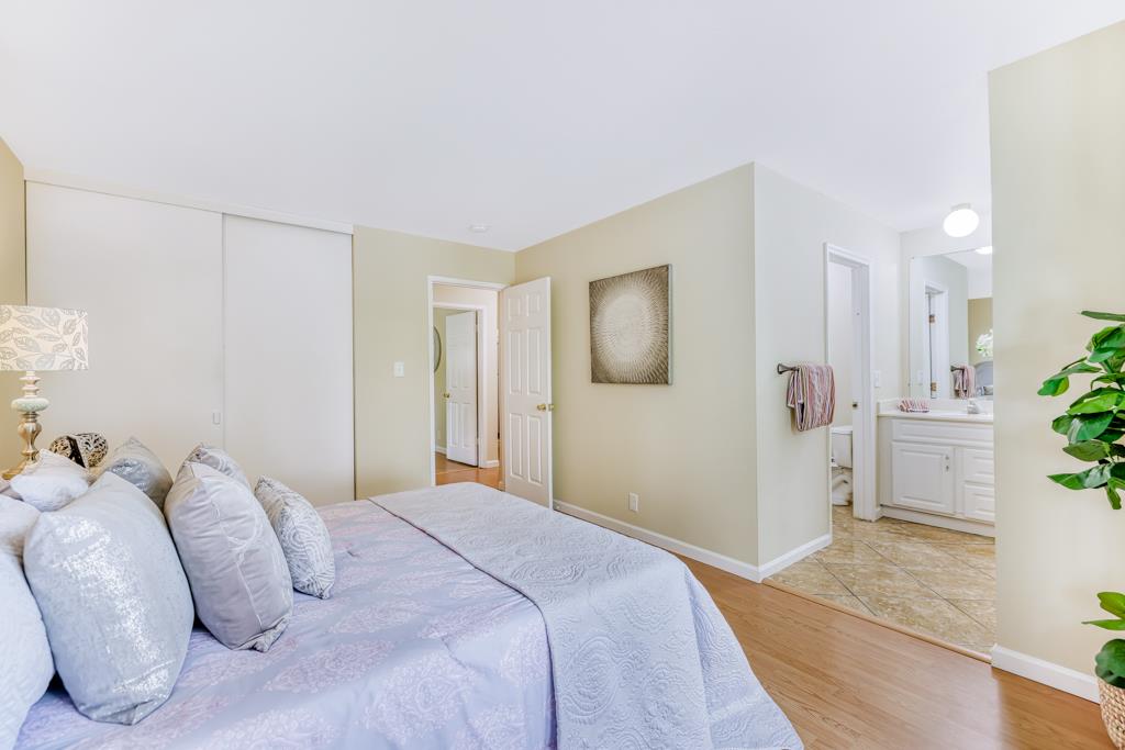 38455 Bronson Street, Unit 322 Fremont, CA 94536 - Photo 19 of 35 a bedroom with a bed and a couch