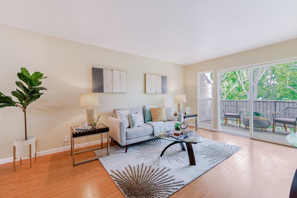 38455 Bronson Street, Unit 322 Fremont, CA 94536 - Photo 2 of 35 a living room with furniture and a large window