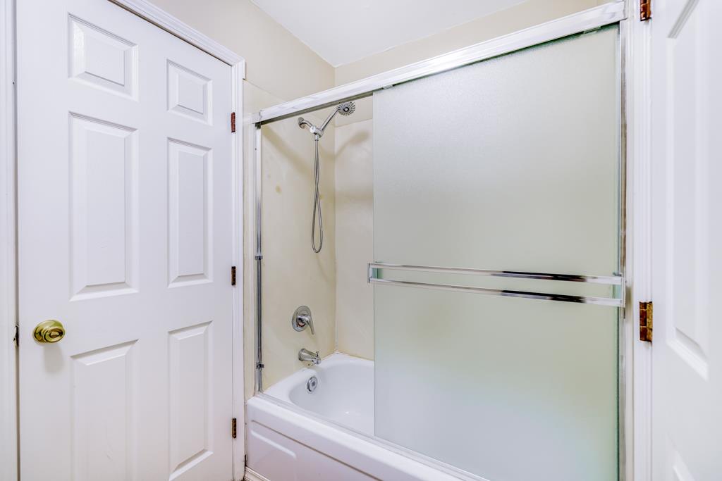 38455 Bronson Street, Unit 322 Fremont, CA 94536 - Photo 21 of 35 a bathroom with a shower and a bath tub